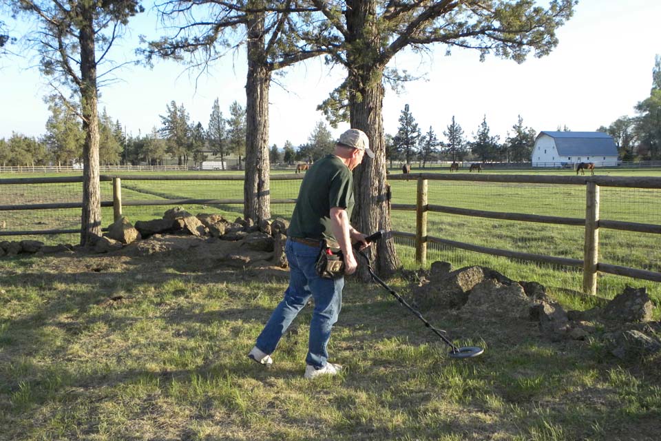 Club member using metal detector at May 2012 meeting.